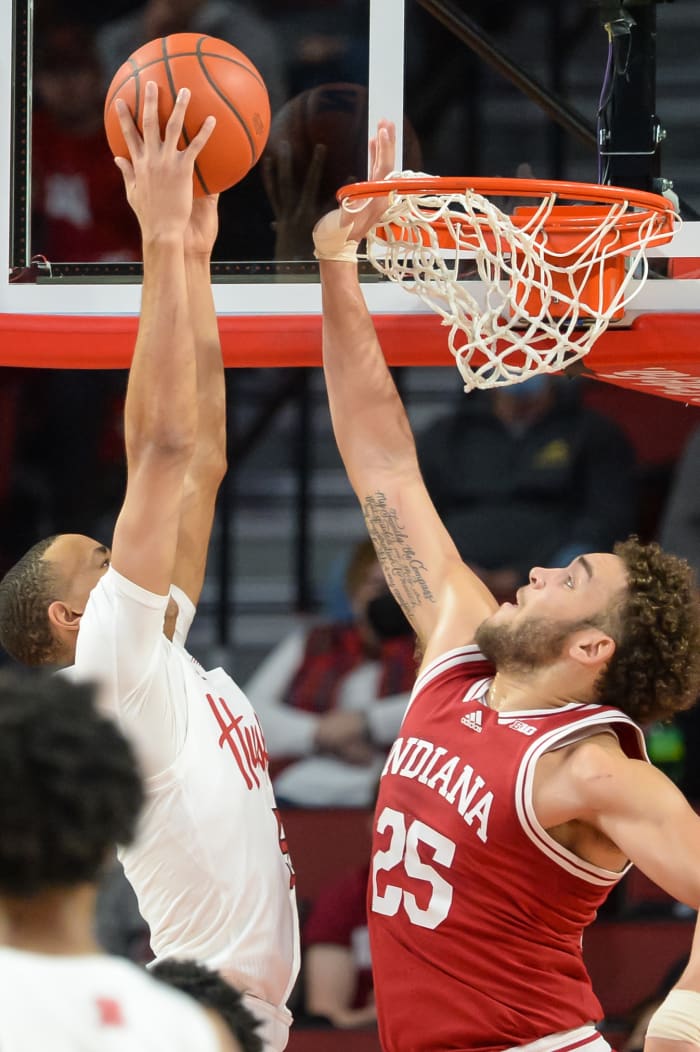 Race Thompson tries to block a dunk.